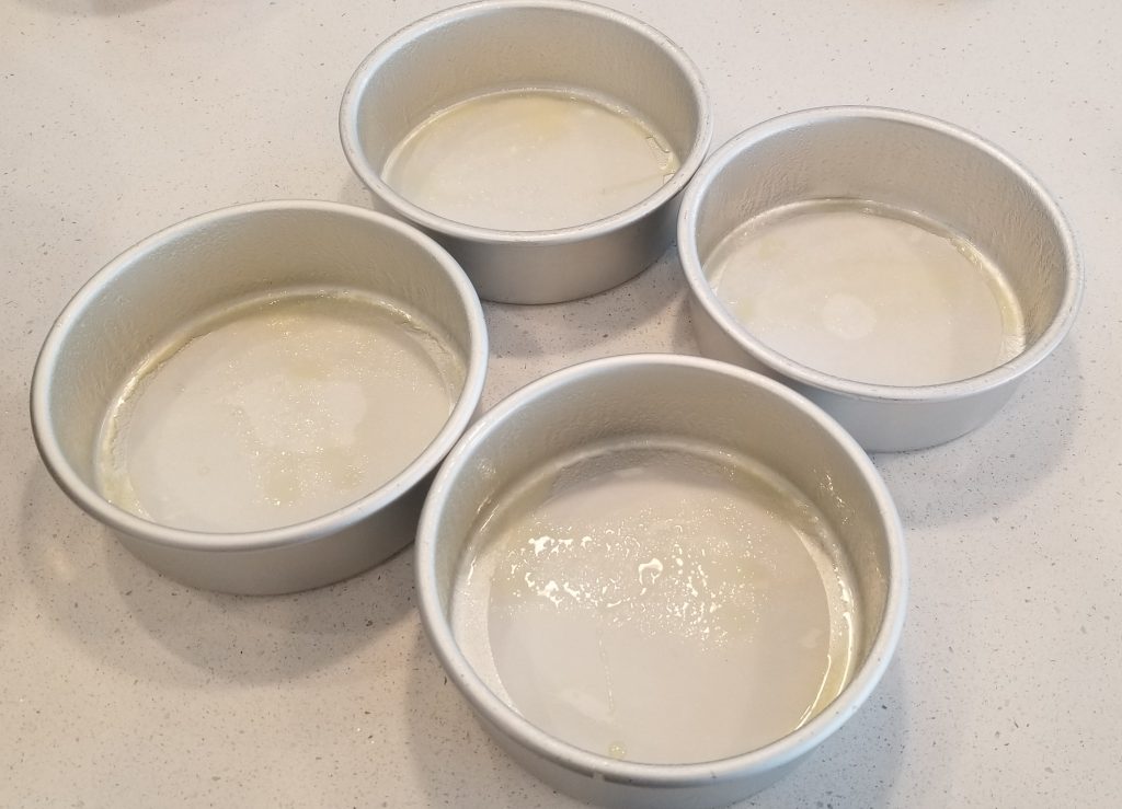 Greased and Lined Cake Pans
