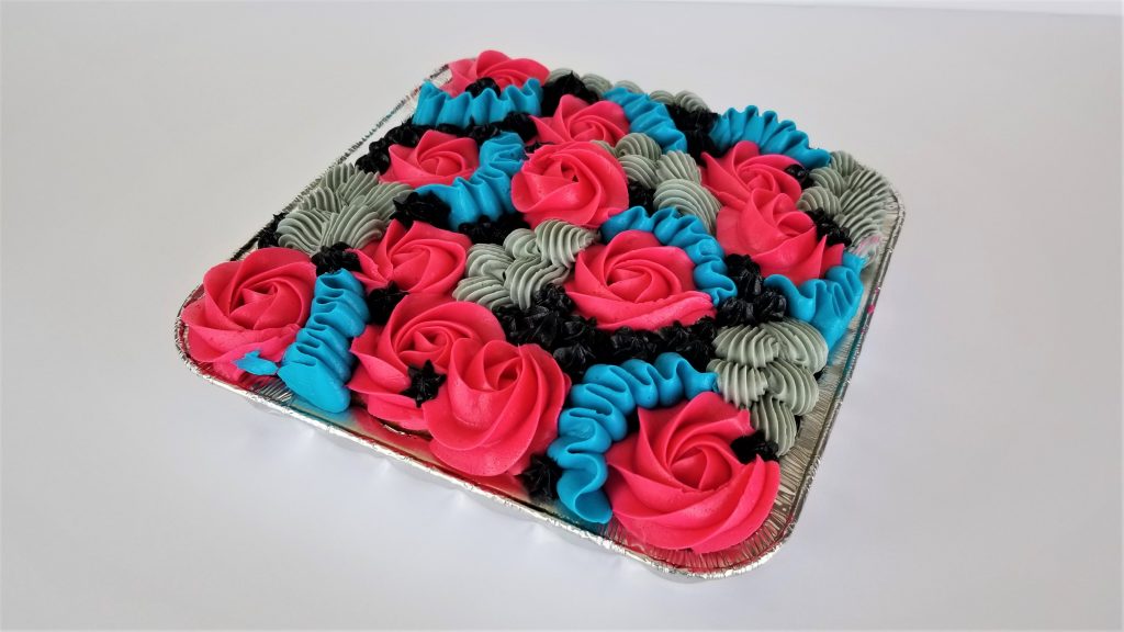 Sheet Cake decorated with simple and colorful piping.