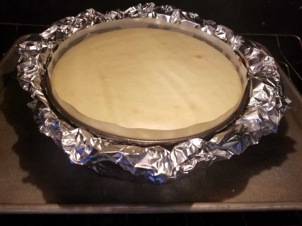 Cheesecake being baked in a water bath