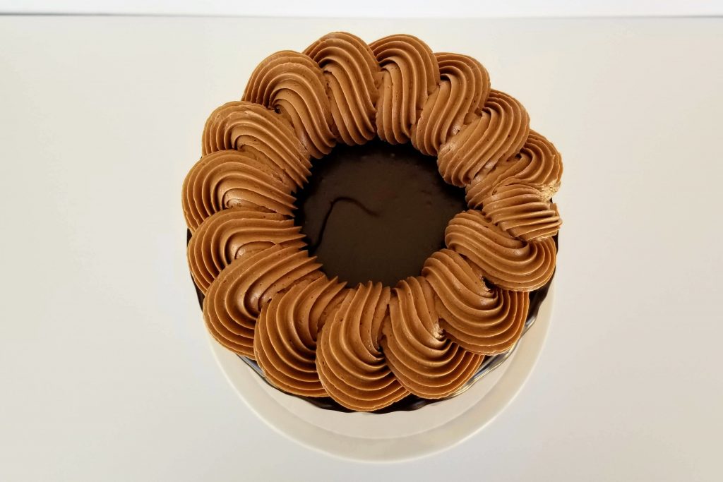 Top View of a Triple Chocolate Cake with a rope boarder