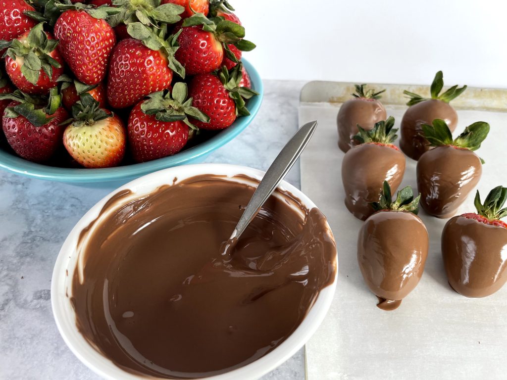 Dipping Strawberries in Milk Chocolate A'Peels